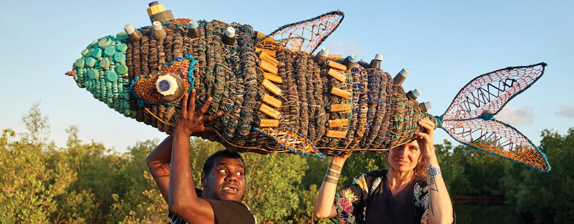 A giant fish built from bottle caps, bottles and netting