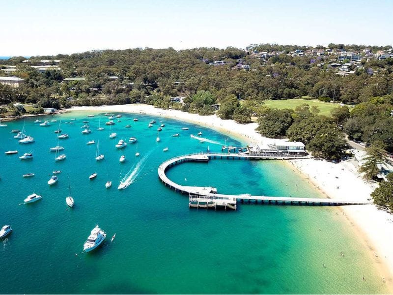 Aerial view of Balmoral Beach, Mosman, with clear turquoise water and moored boats